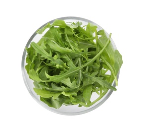 Delicious fresh arugula on glass bowl isolated on white, top view