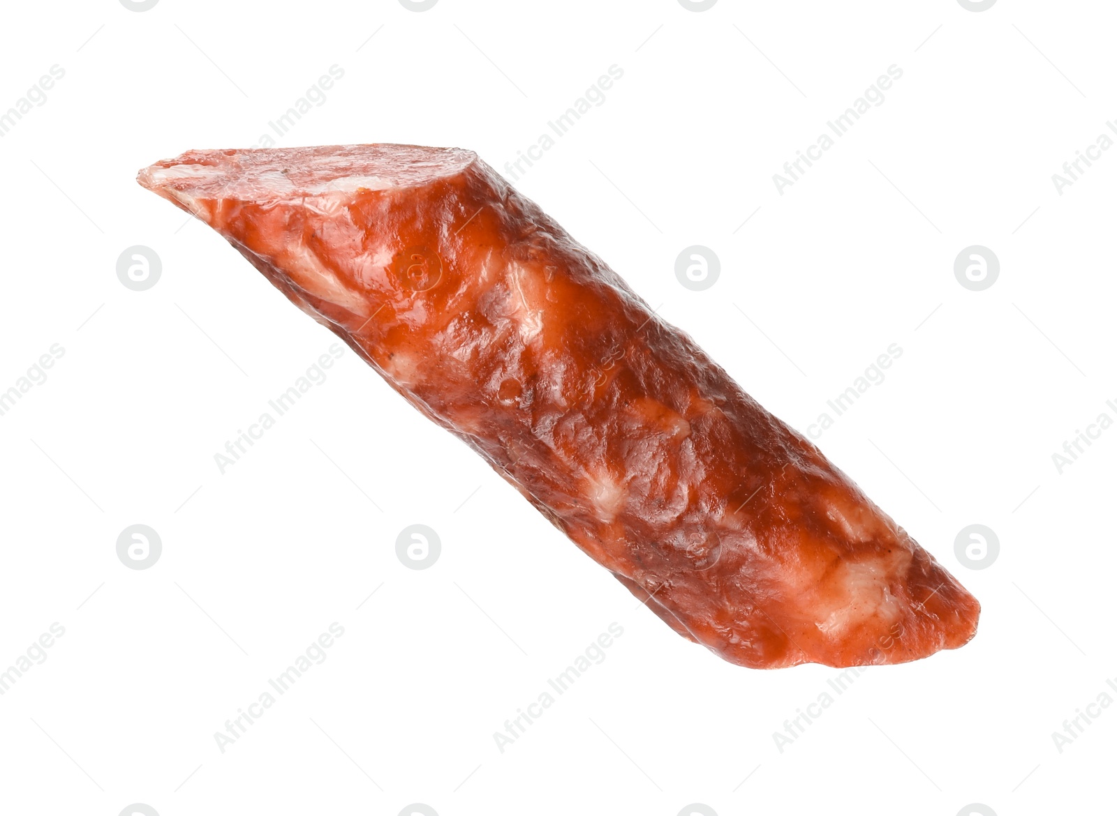 Photo of Piece of thin dry smoked sausage isolated on white