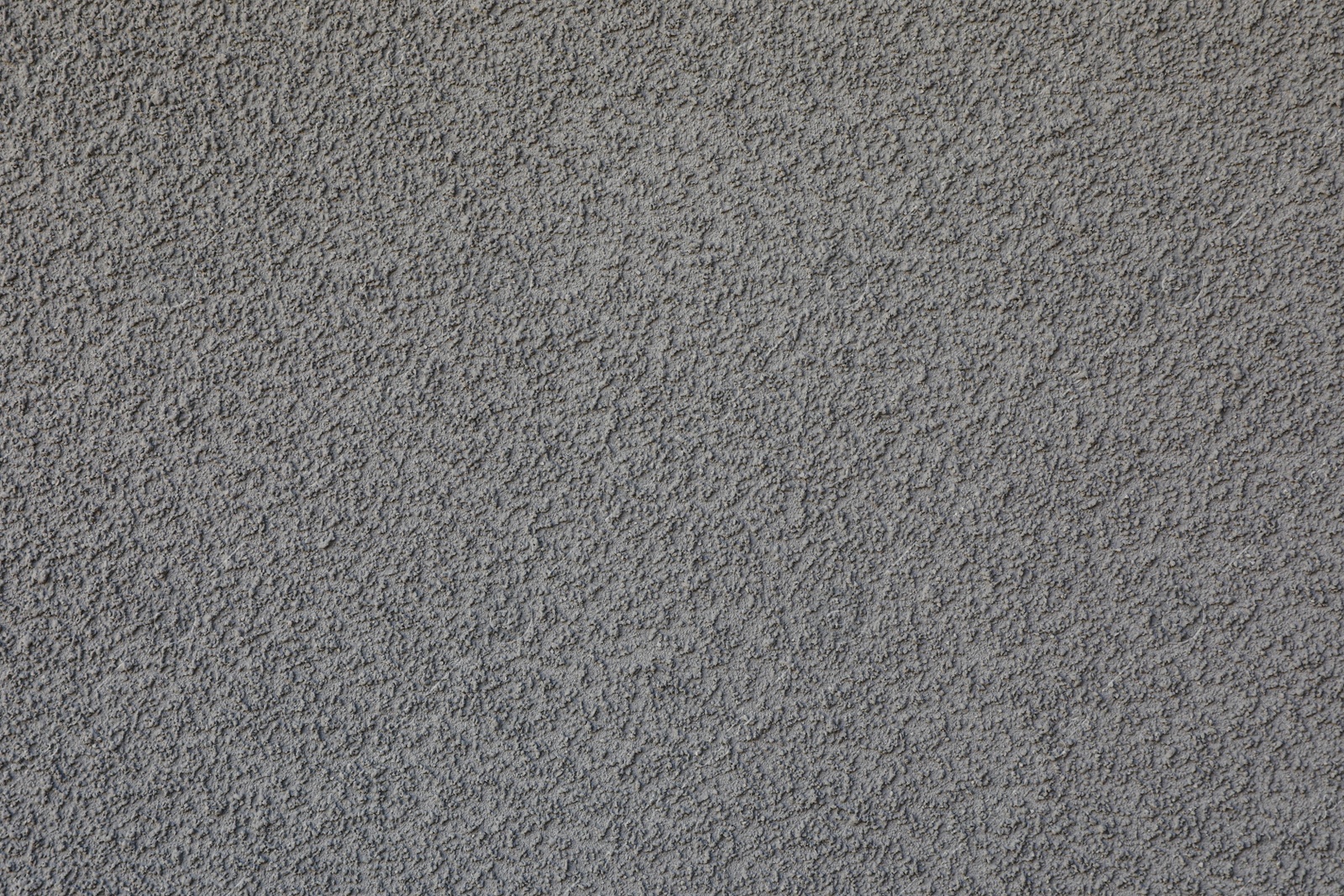 Photo of Texture of grey plaster wall as background