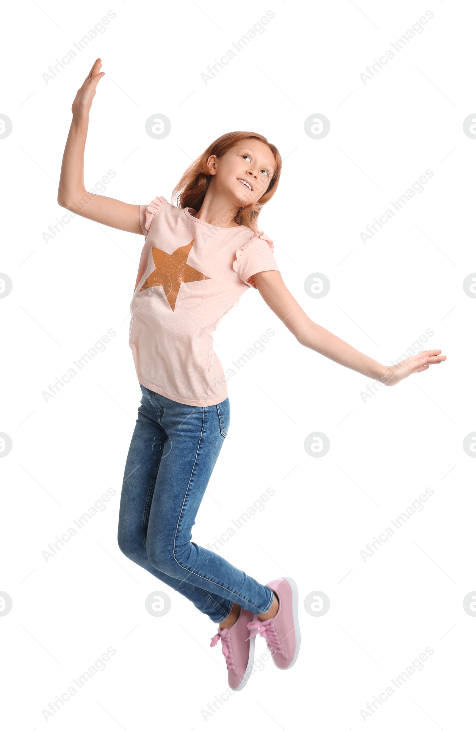 Photo of Full length portrait of preteen girl jumping on white background