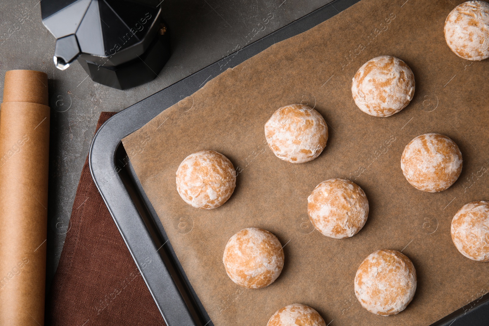 Photo of Tasty homemade gingerbread cookies on grey table, flat lay