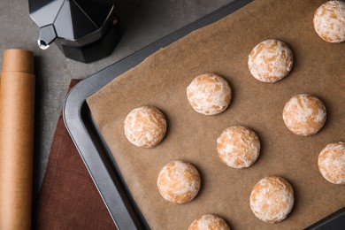 Tasty homemade gingerbread cookies on grey table, flat lay