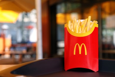 MYKOLAIV, UKRAINE - AUGUST 11, 2021: Big portion of McDonald's French fries on tray in cafe. Space for text