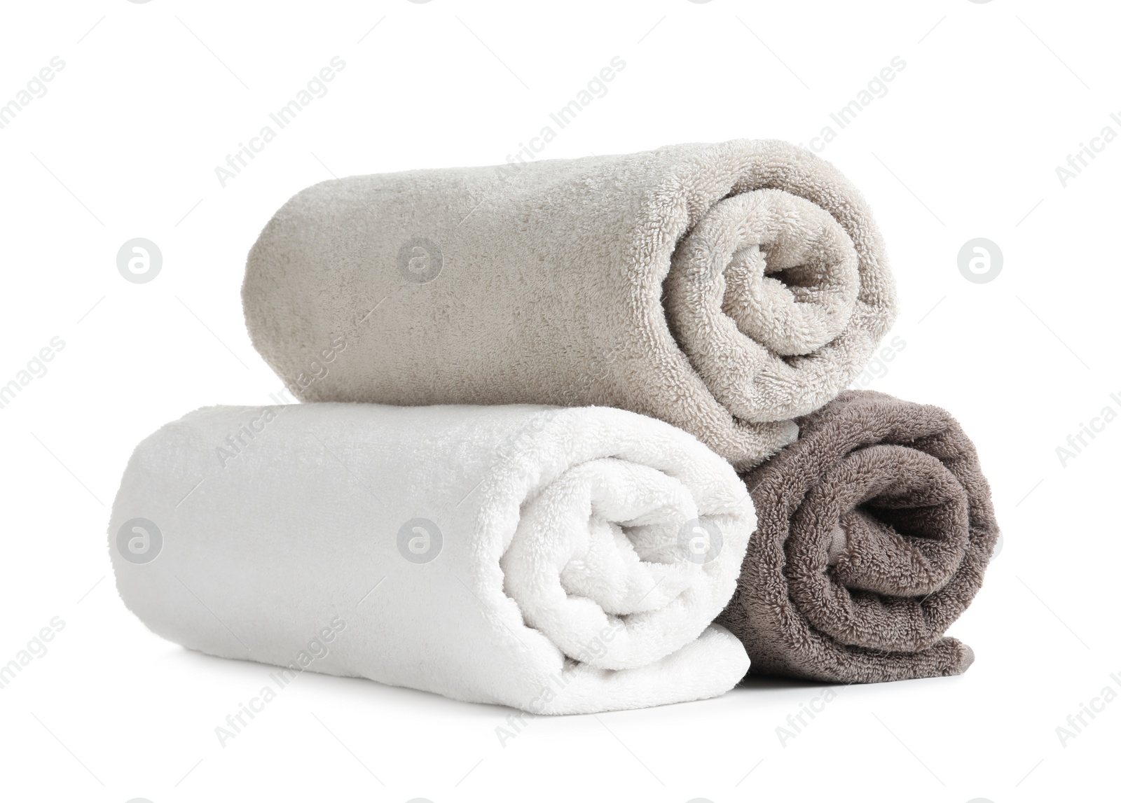 Photo of Rolled soft terry towels on white background