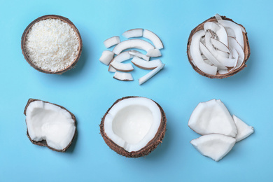 Flat lay composition with fresh coconut flakes on light blue background