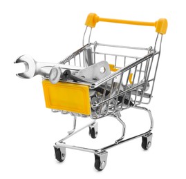 Different construction tools in shopping cart isolated on white