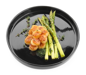 Photo of Delicious fried scallops with asparagus and thyme isolated on white
