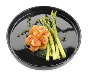 Delicious fried scallops with asparagus and thyme isolated on white