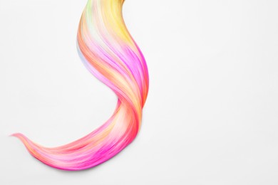 Image of Strand of beautiful multicolored hair on white background, top view