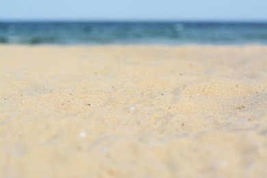 Photo of Beautiful sandy beach near sea, closeup view
