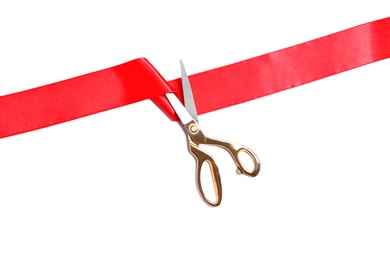 Photo of Ribbon and scissors on white background, top view. Ceremonial red tape cutting