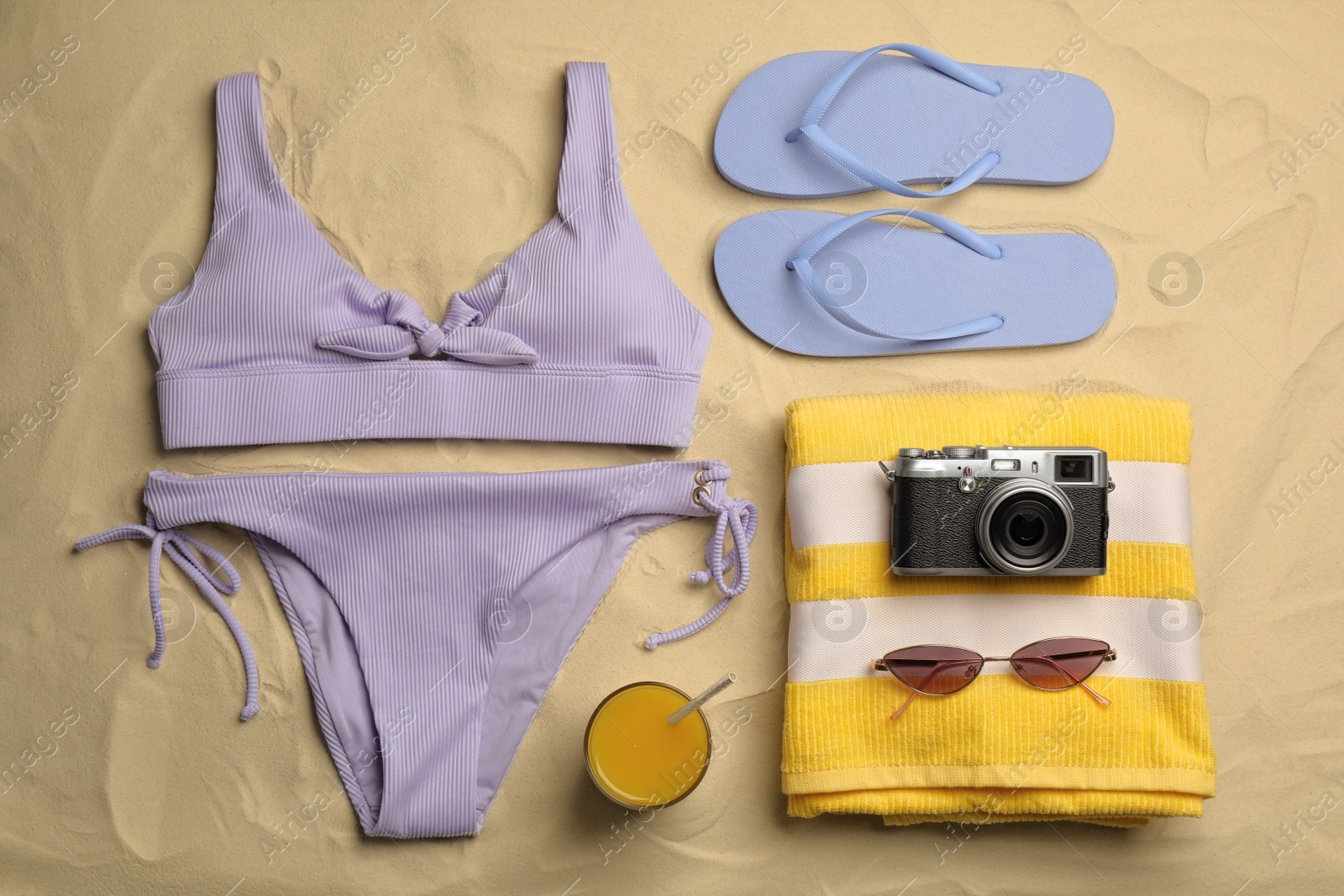 Photo of Flat lay composition with beach objects on sand