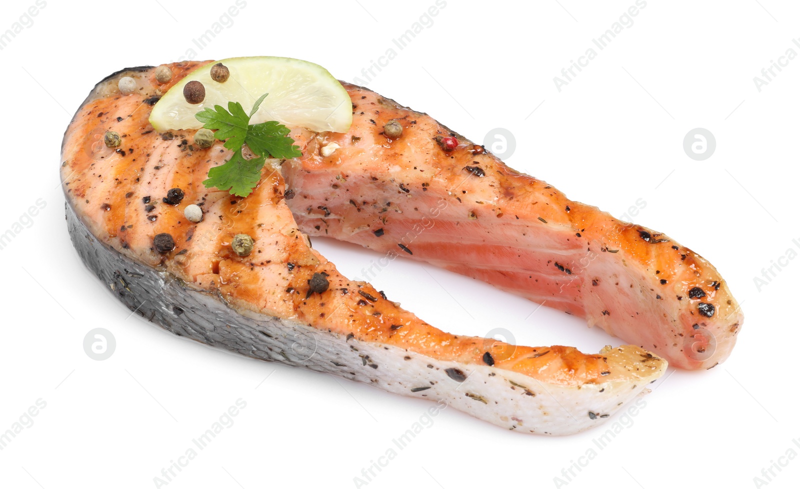 Photo of Tasty salmon steak with lemon, peppercorns and parsley isolated on white