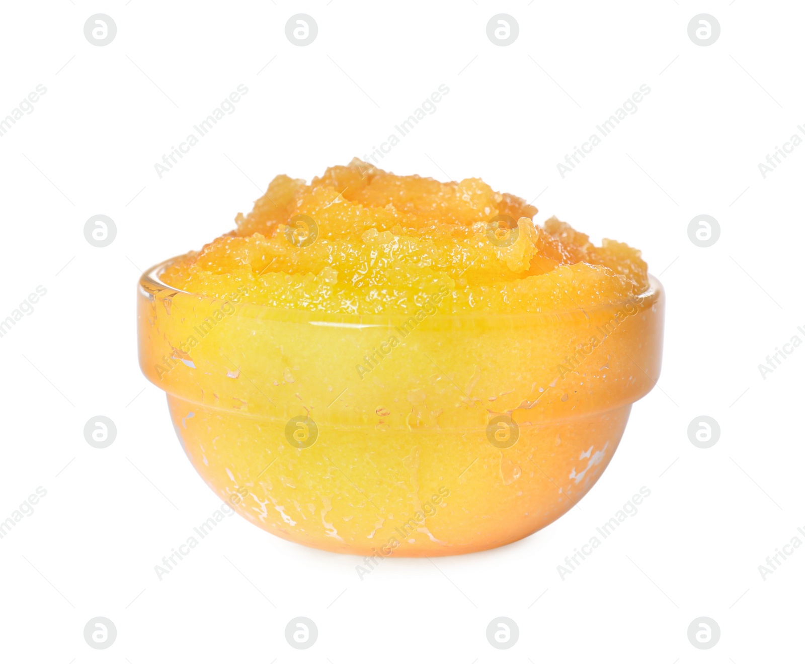 Photo of Glass bowl of yellow body scrub isolated on white