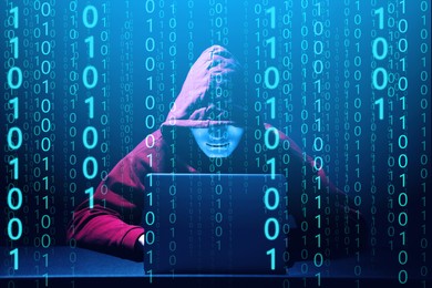 Image of Anonymous man in mask with laptop and binary code in darkness