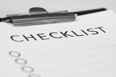 Closeup view of clipboard with inscription Checklist