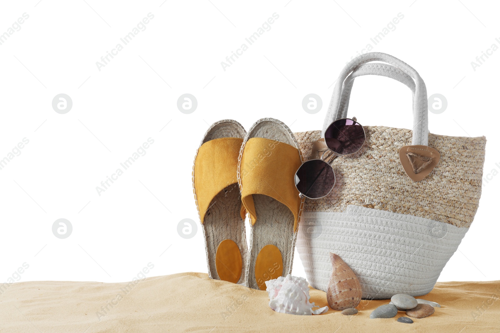 Photo of Composition with beach objects on sand against white background, space for text