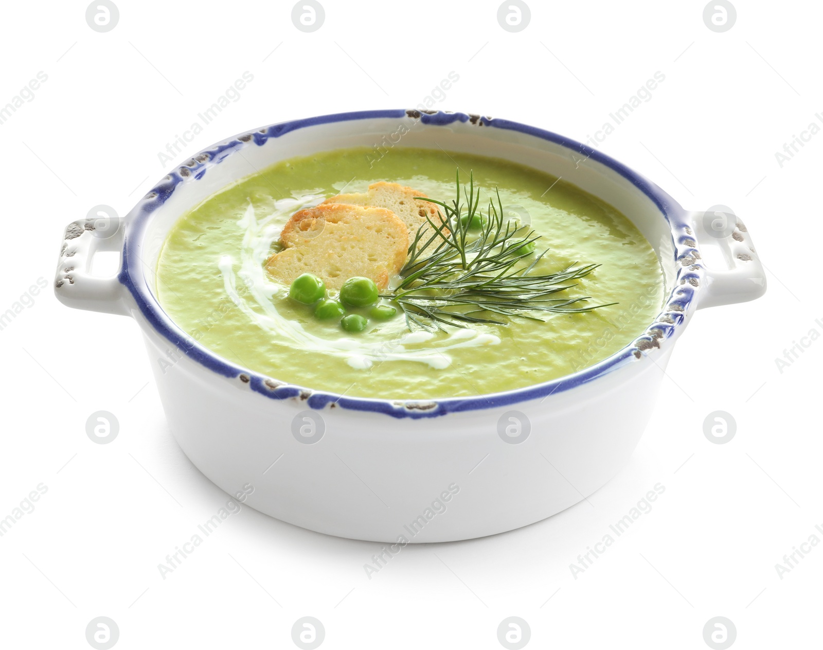 Photo of Fresh vegetable detox soup made of green peas with croutons in dish on white background