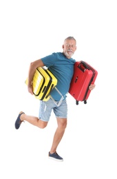 Photo of Senior man with suitcases running on white background. Vacation travel