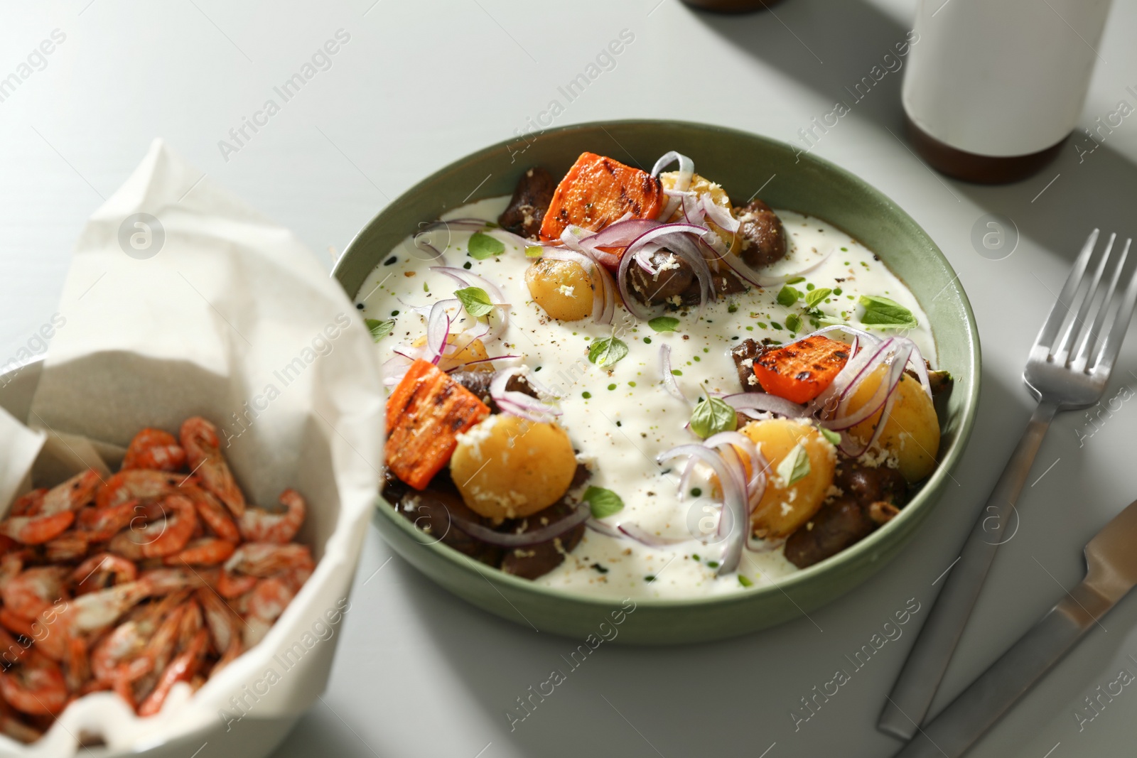 Photo of Tasty dish served on light table, closeup