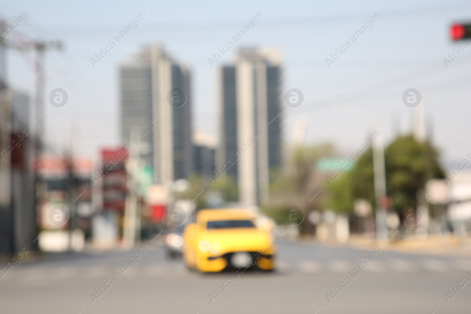 Photo of San Pedro Garza Garcia, Mexico – March 20, 2023: Blurred view of road with cars and buildings, bokeh effect