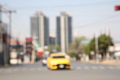 Photo of San Pedro Garza Garcia, Mexico – March 20, 2023: Blurred view of road with cars and buildings, bokeh effect