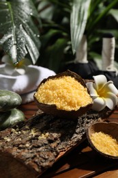 Photo of Spa composition with orange sea salt on wooden table