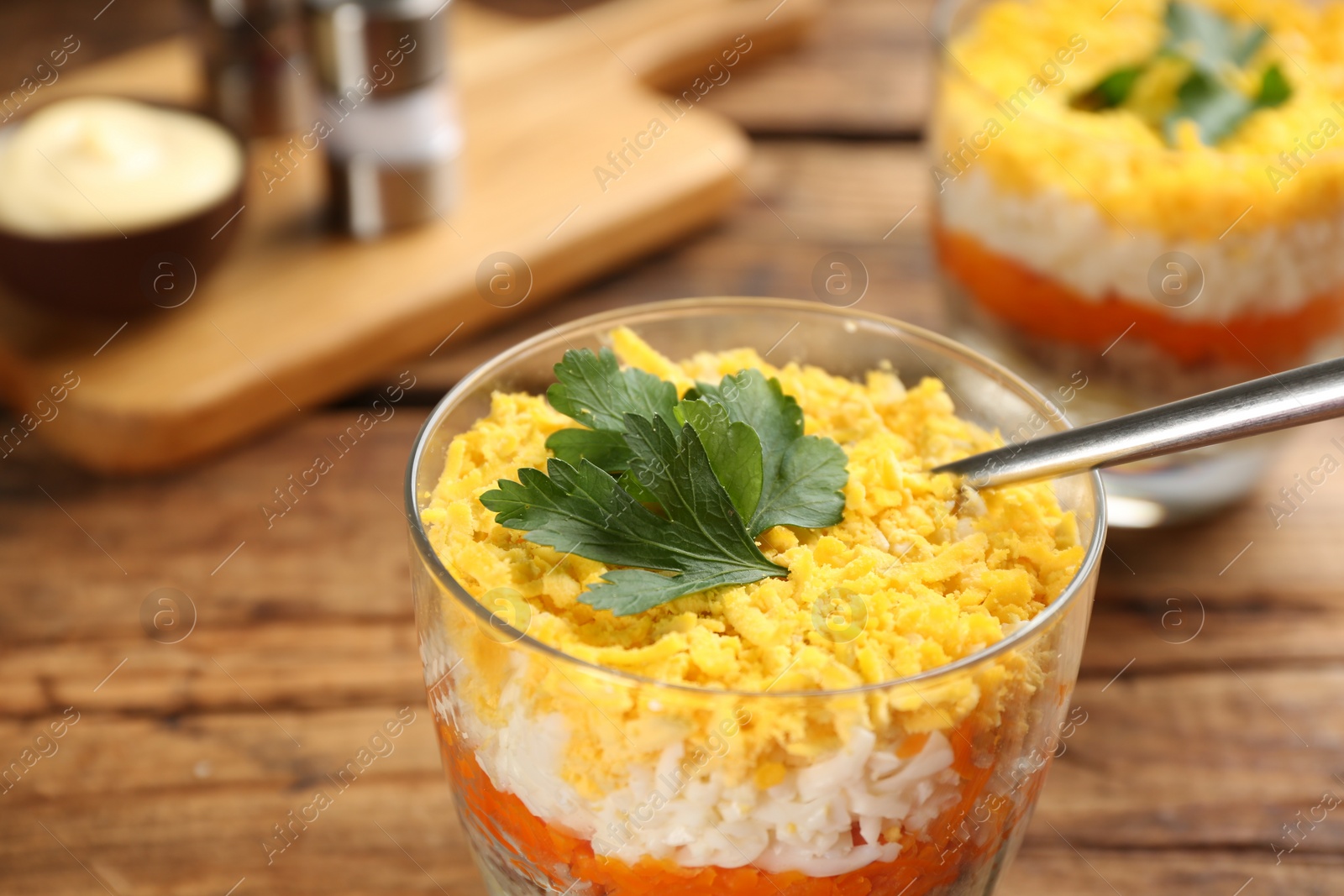 Photo of Traditional russian salad Mimosa on table, closeup