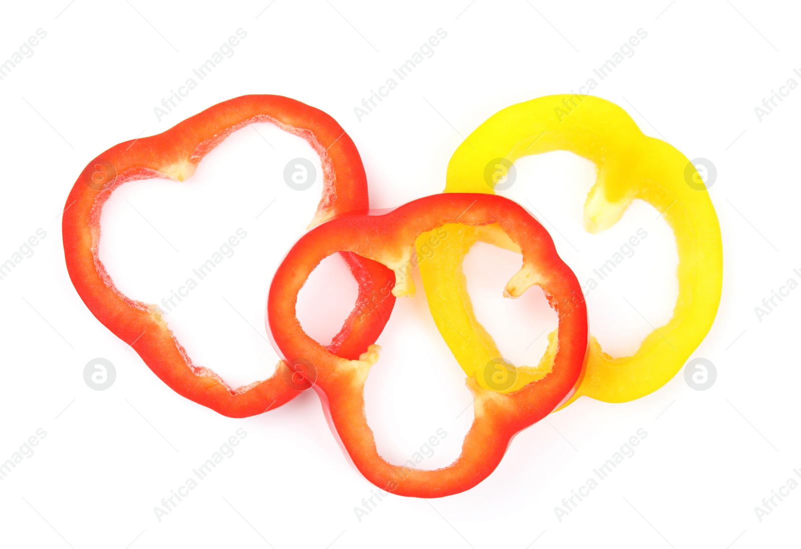 Photo of Rings of ripe bell peppers on white background, top view