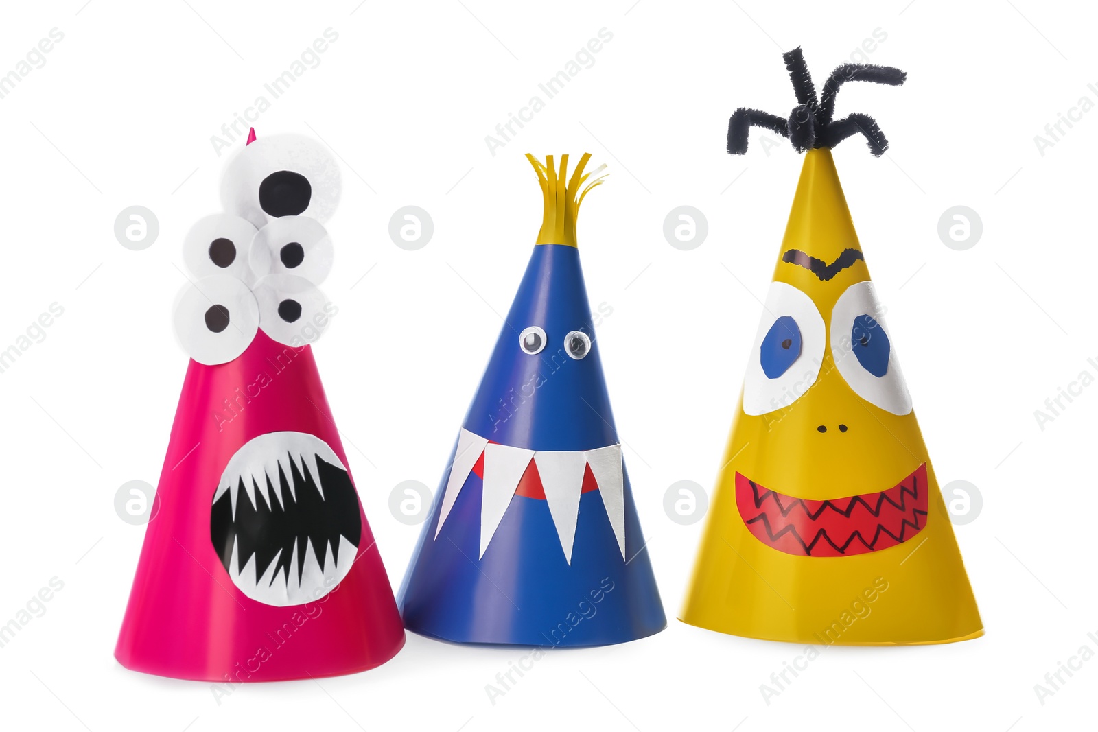 Photo of Funny monsters on white background. Halloween decoration