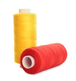 Photo of Different colorful sewing threads on white background