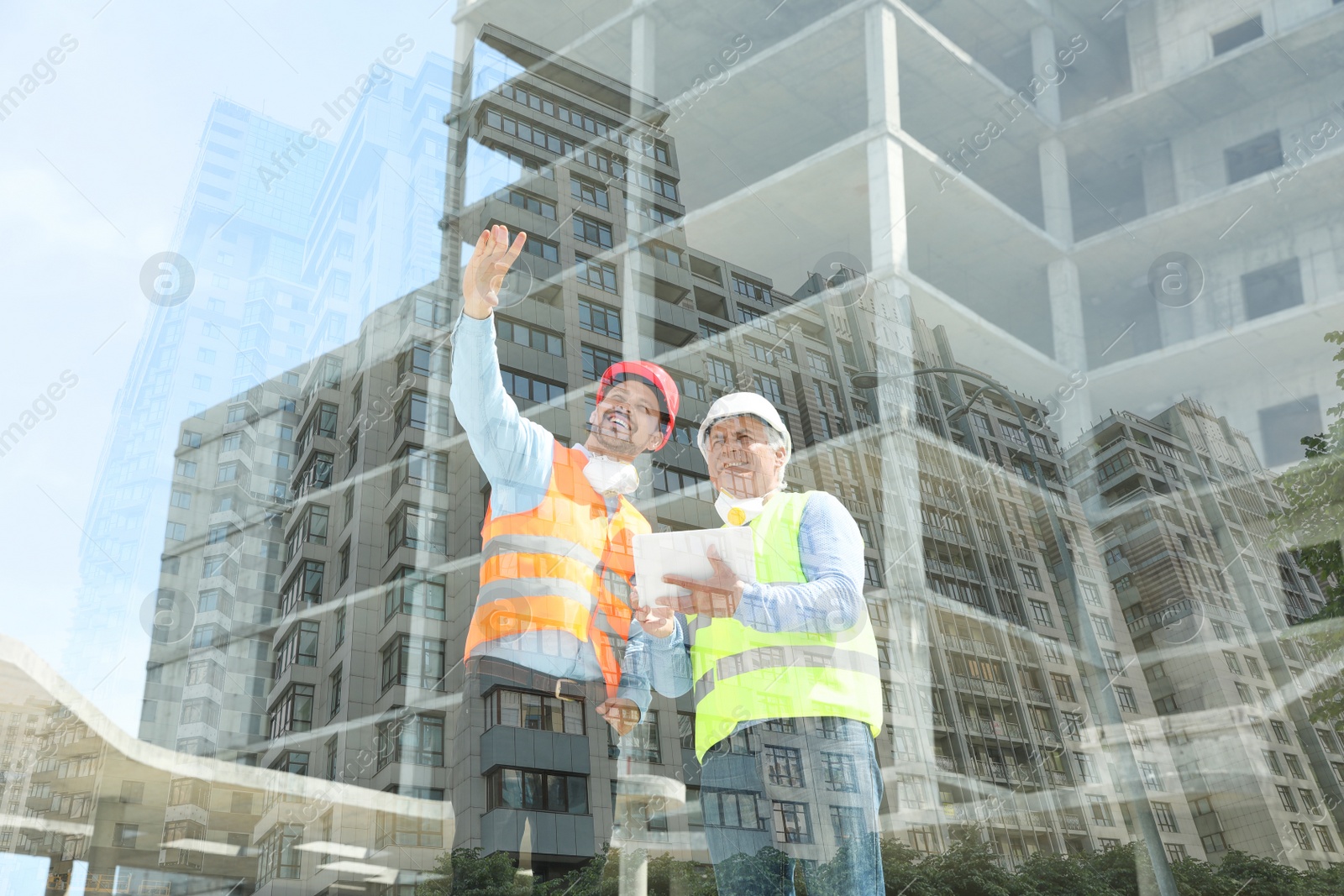 Image of Double exposure of engineers at construction site and modern buildings