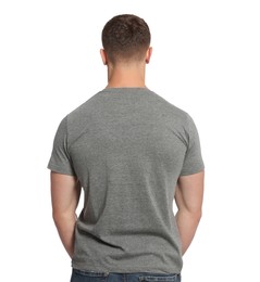 Photo of Man wearing grey t-shirt on white background, back view. Mockup for design