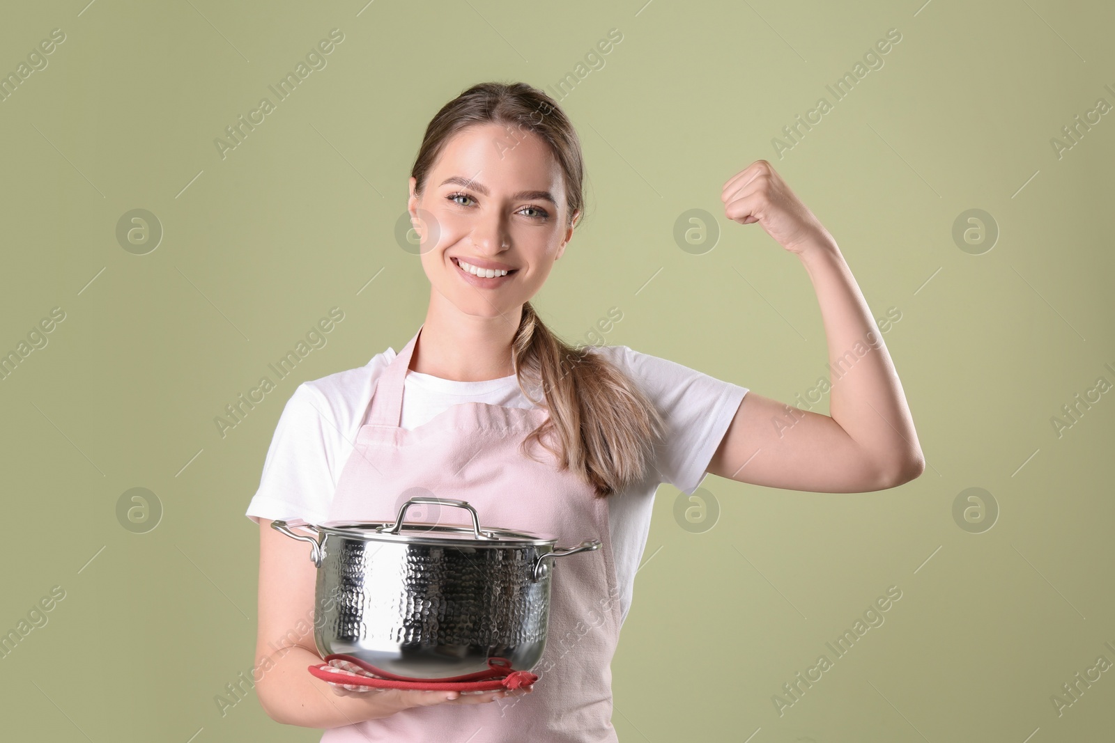 Photo of Happy woman with pot on olive background