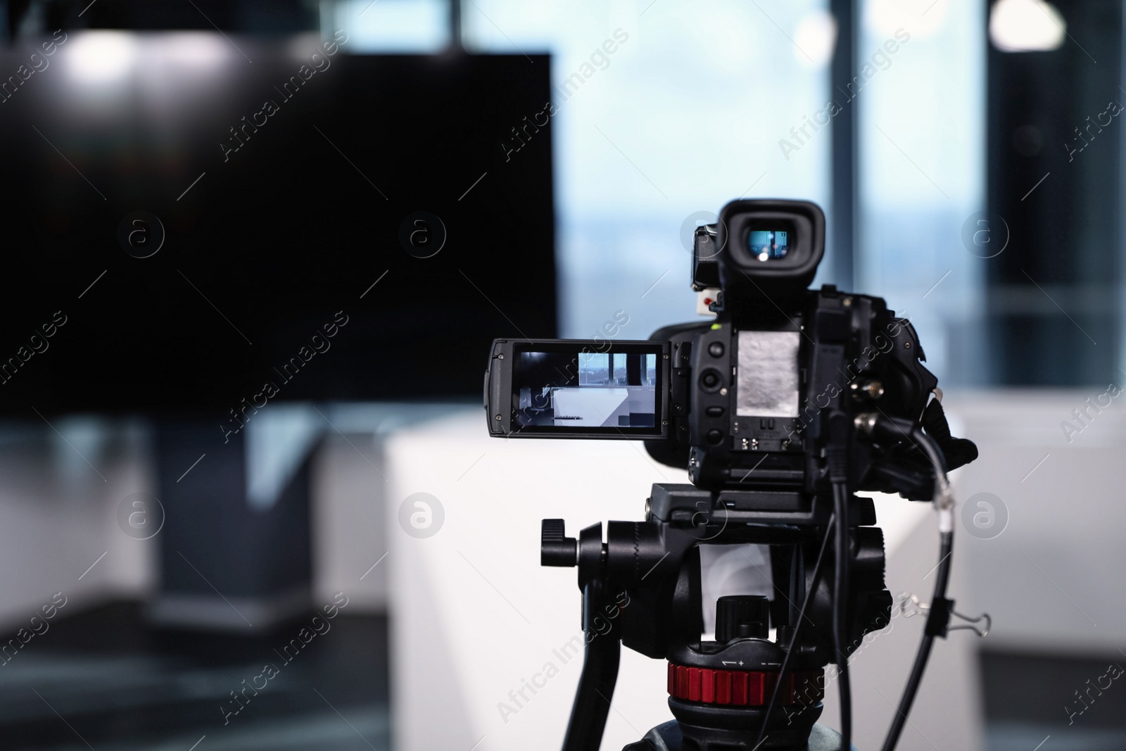 Photo of Modern video recording studio, focus on camera
