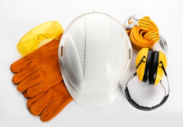 Photo of Set of safety equipment on white background, top view