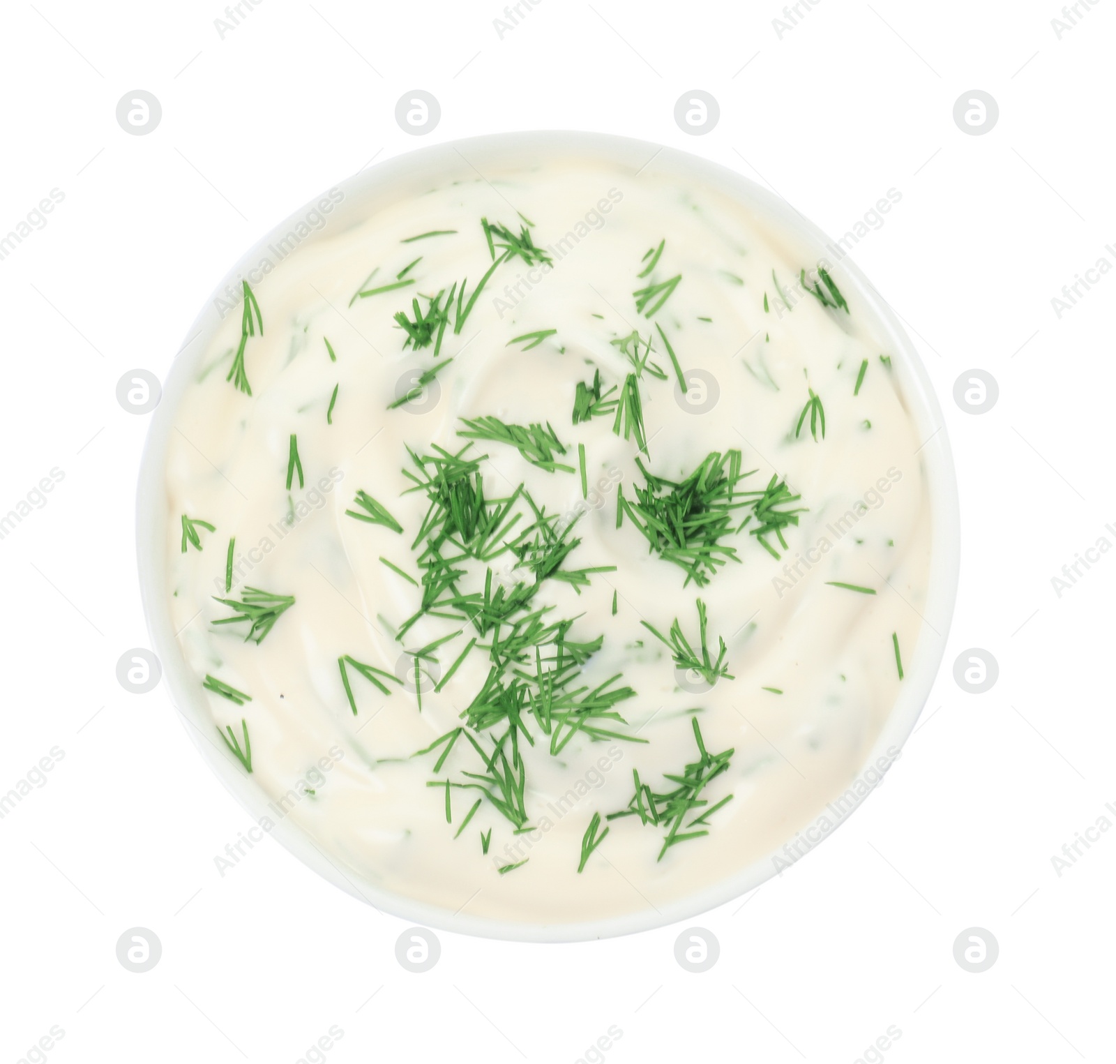 Photo of Tasty creamy dill sauce in bowl isolated on white, top view