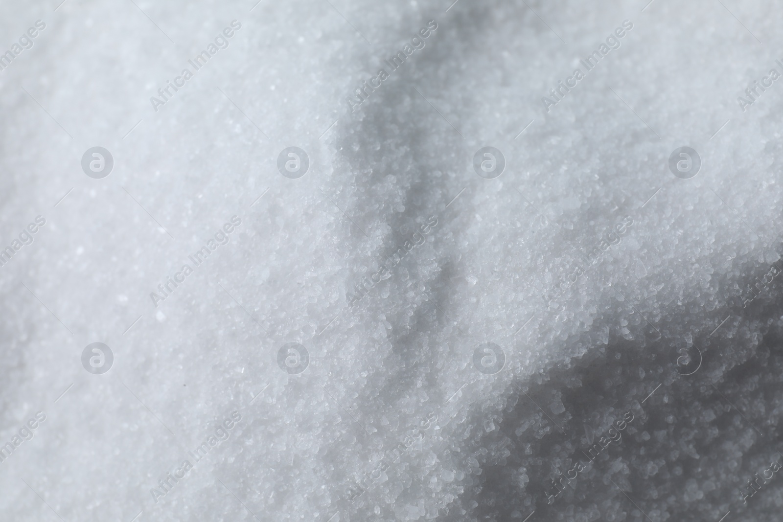 Photo of Organic white sea salt as background, above view