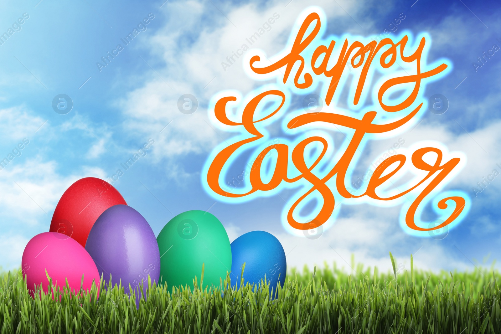 Image of Happy Easter. Bright dyed eggs on green grass outdoors