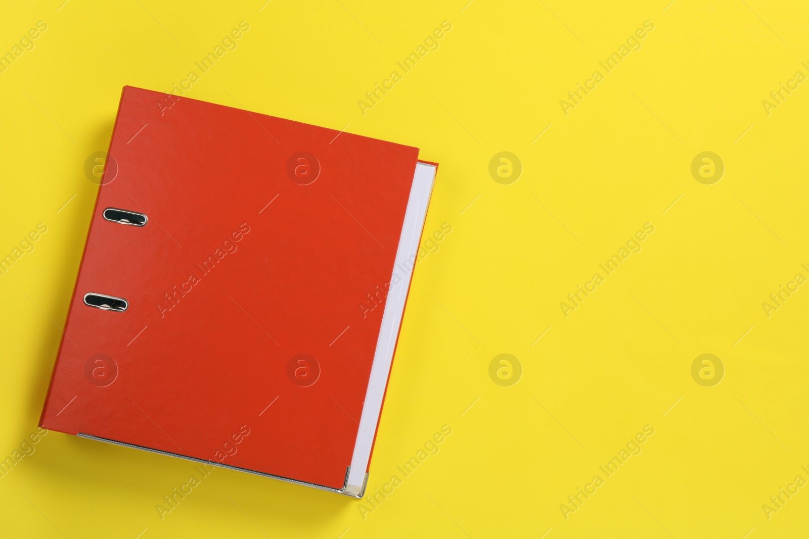 Photo of Red office folder on yellow background, top view, Space for text