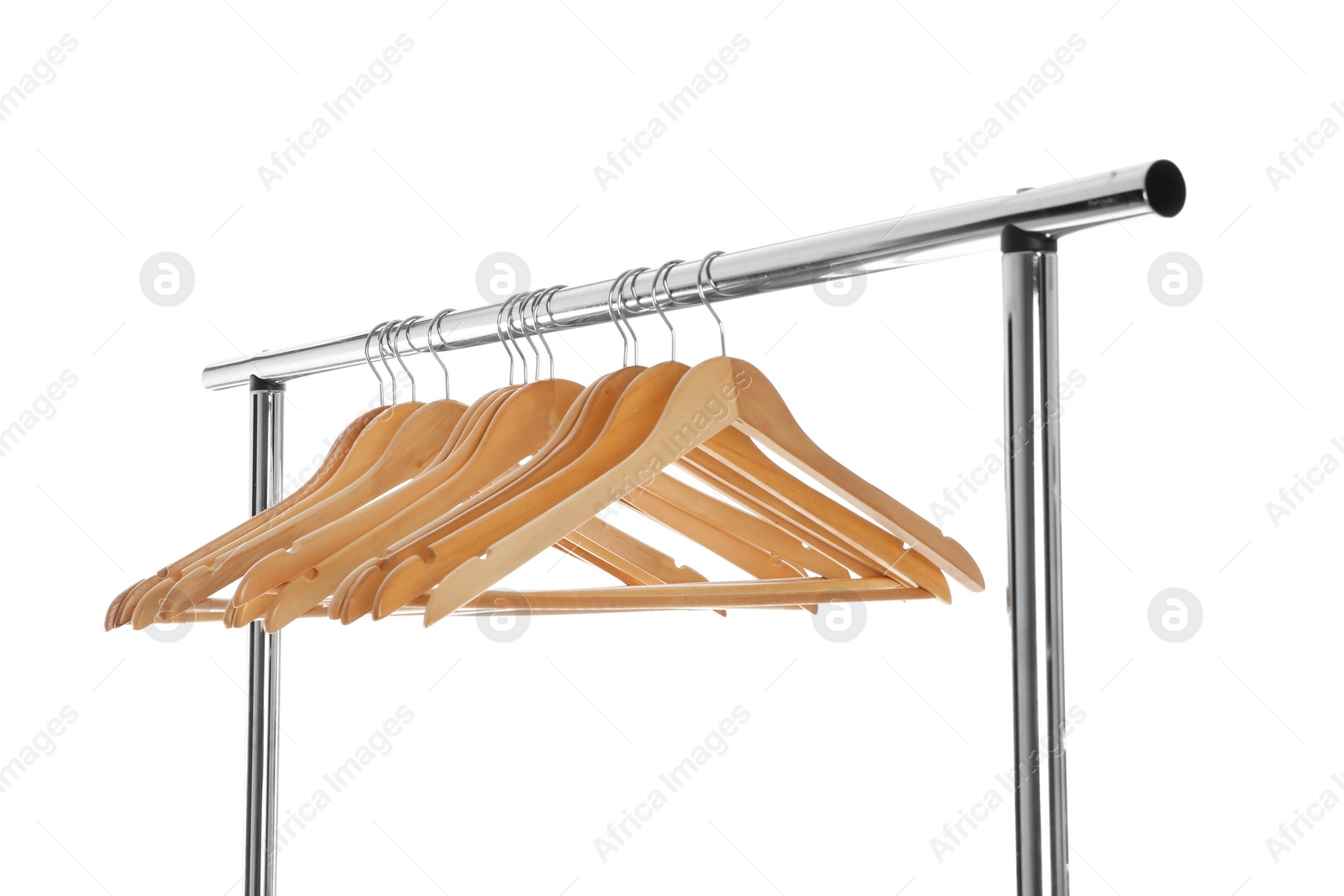 Photo of Wardrobe rack with wooden hangers isolated on white