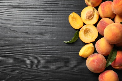 Photo of Flat lay composition with ripe peaches on wooden background