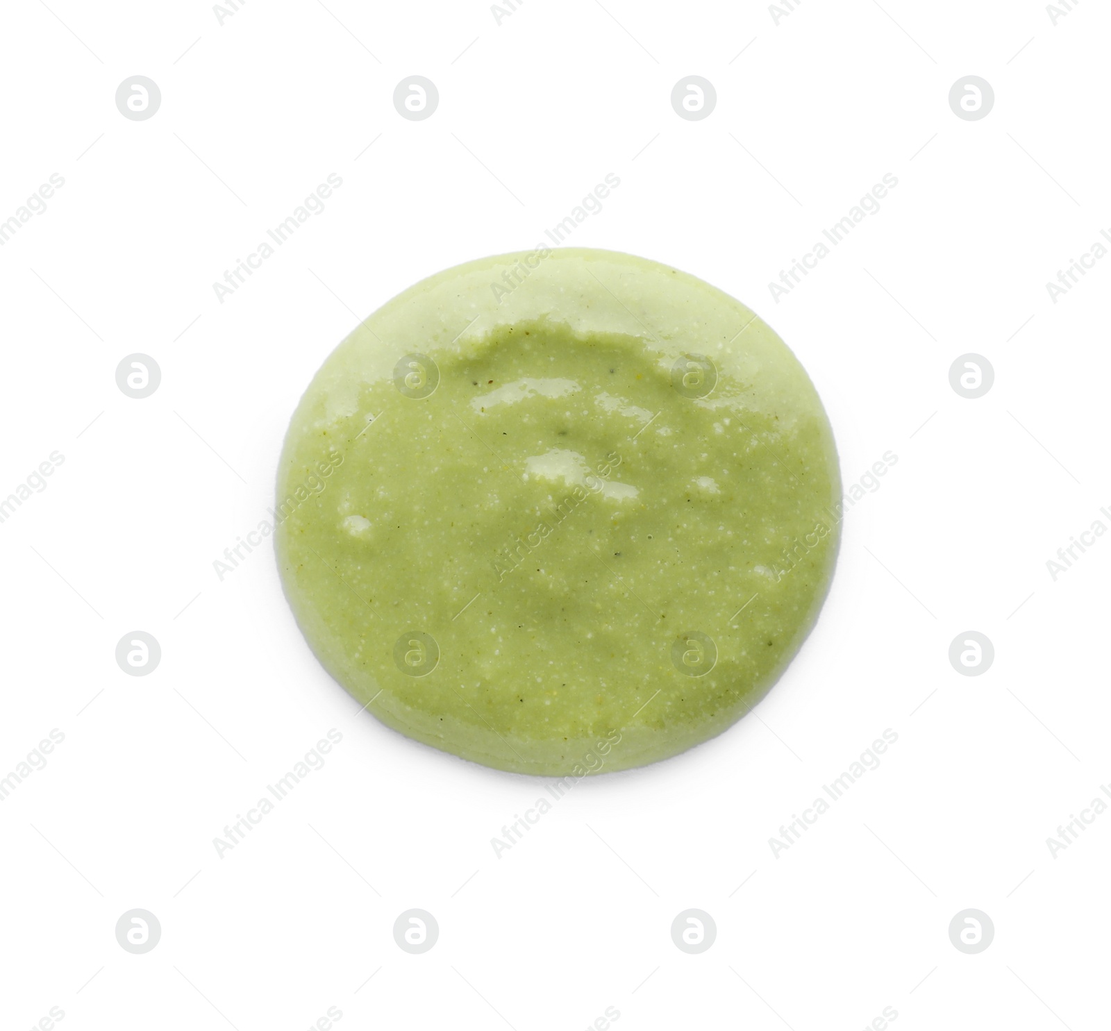 Photo of Swirl of delicious spicy wasabi paste isolated on white, top view