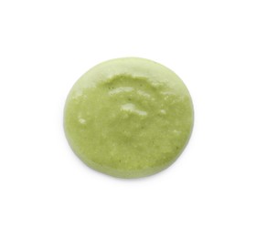 Photo of Swirl of delicious spicy wasabi paste isolated on white, top view