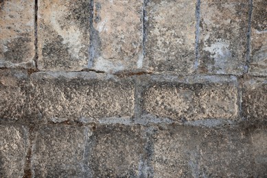 Texture of old stone pavement as background, top view