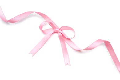 Pink satin ribbon with bow isolated on white, top view