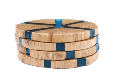 Stack of wooden cup coasters on white background