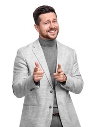 Handsome bearded businessman in suit pointing at something on white background