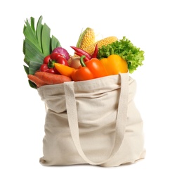 Photo of Shopping bag with fresh vegetables on white background
