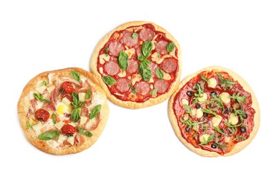 Delicious pita pizzas on white background, top view
